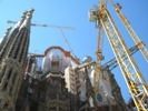 Modern tower cranes and workers wearing PPE are raising the Sagrada Familia spires ever higher.